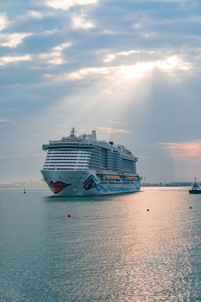 Luxury cruise ship floating in sea during susnet