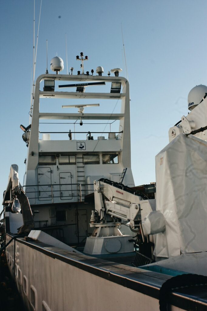 Modern battleship full of technology and satellites against the blue sky